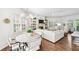 Spacious living area with a fireplace, dining area, and lots of natural light from many windows with shutters at 1717 N Decatur Ne Rd # 322, Atlanta, GA 30307