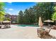 Community pool area with lounge chairs and shaded seating at 1717 N Decatur Ne Rd # 322, Atlanta, GA 30307