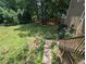 Overhead view of an expansive backyard with lush lawn, mature trees, and a wooded area at 5882 Grandview Nw Ct, Acworth, GA 30101