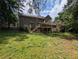 View of the backyard, showing the deck, patio and lawn of the property at 5882 Grandview Nw Ct, Acworth, GA 30101