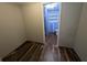Bathroom featuring wood-look flooring and a peek at blue shower tiles at 5882 Grandview Nw Ct, Acworth, GA 30101