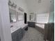 Bright bathroom with double sinks, a soaking tub, and a walk-in shower at 5882 Grandview Nw Ct, Acworth, GA 30101