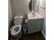 Cozy half bathroom featuring updated vanity, toilet, and decorative wall art at 5882 Grandview Nw Ct, Acworth, GA 30101
