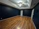 Spacious bedroom featuring wood floors, tray ceiling, and ample natural light at 5882 Grandview Nw Ct, Acworth, GA 30101