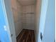 Walk-in closet with wire shelves and wood-look floors for ample storage at 5882 Grandview Nw Ct, Acworth, GA 30101