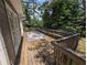 Spacious outdoor deck with bench seating and view of wooded backyard at 5882 Grandview Nw Ct, Acworth, GA 30101