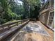 Large wood deck with an outdoor rug provides ample space for entertaining and relaxing at 5882 Grandview Nw Ct, Acworth, GA 30101