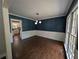 Dining room showcasing dark hardwood floors, decorative wallpaper, and natural light at 5882 Grandview Nw Ct, Acworth, GA 30101