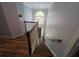 Bright foyer featuring wood floors, stairs, high ceilings, and large window at 5882 Grandview Nw Ct, Acworth, GA 30101