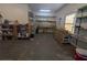 Well-lit garage with ample shelving, providing plenty of storage and workspace at 5882 Grandview Nw Ct, Acworth, GA 30101