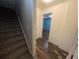 Hallway featuring wood-look flooring, leading to a room with blue walls at 5882 Grandview Nw Ct, Acworth, GA 30101