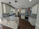 Modern kitchen with white cabinetry, granite countertops, and stainless steel appliances at 5882 Grandview Nw Ct, Acworth, GA 30101