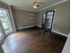 Living room featuring hardwood floors, a ceiling fan, and bright, sunlit windows at 5882 Grandview Nw Ct, Acworth, GA 30101