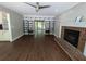 Living room boasting hardwood floors, a fireplace, and decorative wallpaper for added style at 5882 Grandview Nw Ct, Acworth, GA 30101