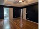 The primary bedroom offers wood floors, dark walls, and an ensuite bath at 5882 Grandview Nw Ct, Acworth, GA 30101