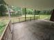 Covered patio offers shade and a peaceful view of the expansive backyard at 5882 Grandview Nw Ct, Acworth, GA 30101