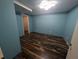 Room with wood floors and freshly painted blue walls at 5882 Grandview Nw Ct, Acworth, GA 30101