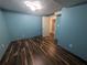 Room featuring wood floors and freshly painted blue walls at 5882 Grandview Nw Ct, Acworth, GA 30101
