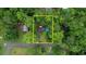 Aerial view of property boundaries in wooded setting near the road; surrounded by mature trees at 749 Dogwood Dr, Lawrenceville, GA 30046
