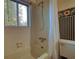 Bathroom featuring bathtub and sunflower-themed wallpapered walls at 749 Dogwood Dr, Lawrenceville, GA 30046
