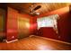 Bedroom featuring a wood ceiling with fan, window, and red walls at 749 Dogwood Dr, Lawrenceville, GA 30046