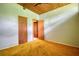 Bedroom featuring a wood ceiling, multiple doors, and orange carpet at 749 Dogwood Dr, Lawrenceville, GA 30046