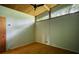 Bedroom featuring a wood ceiling with fan, picture window, and carpet at 749 Dogwood Dr, Lawrenceville, GA 30046