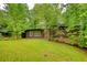 Inviting home exterior featuring a well-kept lawn and mature trees, offering a serene and private setting at 749 Dogwood Dr, Lawrenceville, GA 30046