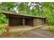 Spacious carport of this home offers ample parking, complemented by well-maintained landscaping at 749 Dogwood Dr, Lawrenceville, GA 30046
