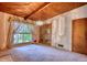 Living room featuring hardwood ceilings, chandelier lighting, and built-in shelving at 749 Dogwood Dr, Lawrenceville, GA 30046