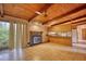 Open-concept room with a stone fireplace and wooden ceiling at 749 Dogwood Dr, Lawrenceville, GA 30046