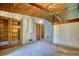 Living room featuring hardwood ceilings, chandelier lighting, and built-in shelving at 749 Dogwood Dr, Lawrenceville, GA 30046