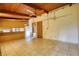 Open-concept room with tile floors, wooden ceiling, and views into the kitchen at 749 Dogwood Dr, Lawrenceville, GA 30046