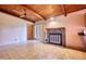 Spacious living room featuring a stone fireplace and wood-beamed ceiling at 749 Dogwood Dr, Lawrenceville, GA 30046