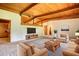 Virtual staging of the spacious living room with hardwood ceilings and large windows at 749 Dogwood Dr, Lawrenceville, GA 30046