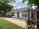 A relaxing backyard view with patio, trimmed lawn, white siding, and fenced boundary at 1245 Mulberry Mill Ln, Lawrenceville, GA 30043
