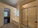 Bright bathroom with tub, separate shower, and tile flooring at 1245 Mulberry Mill Ln, Lawrenceville, GA 30043