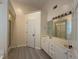 Bright bathroom featuring a double vanity and tile floors at 1245 Mulberry Mill Ln, Lawrenceville, GA 30043
