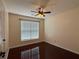 Cozy bedroom with hardwood floors and ceiling fan at 1245 Mulberry Mill Ln, Lawrenceville, GA 30043