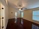 Large bedroom featuring hardwood floors, a ceiling fan, and plenty of natural light at 1245 Mulberry Mill Ln, Lawrenceville, GA 30043
