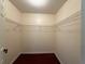 Walk-in closet with metal shelving and hardwood floors at 1245 Mulberry Mill Ln, Lawrenceville, GA 30043
