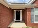 Up close view of the exterior brick entryway and sidelights at 1245 Mulberry Mill Ln, Lawrenceville, GA 30043