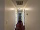 Bright hallway with hardwood floors connecting various rooms in the home at 1245 Mulberry Mill Ln, Lawrenceville, GA 30043