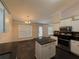 Well-lit kitchen with stainless steel appliances and a center island providing ample counter space at 1245 Mulberry Mill Ln, Lawrenceville, GA 30043