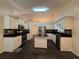 Modern kitchen with stainless steel appliances, granite countertops, and a center island at 1245 Mulberry Mill Ln, Lawrenceville, GA 30043