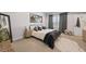 Serene bedroom with a large window, neutral tones, and comfortable bed at 125 Climbing Ivy Cir, Fayetteville, GA 30214