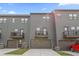 Exterior view of modern townhomes with private balconies and attached garages at 125 Climbing Ivy Cir, Fayetteville, GA 30214