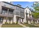 Stunning townhouse with neutral paint, modern design, and a covered front porch at 125 Climbing Ivy Cir, Fayetteville, GA 30214