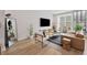 Stylish living room with neutral decor, hardwood floors and a modern design at 125 Climbing Ivy Cir, Fayetteville, GA 30214