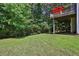 Backyard view showcasing deck and grass area at 1387 Sw Haynes Meadow Trl, Grayson, GA 30017
